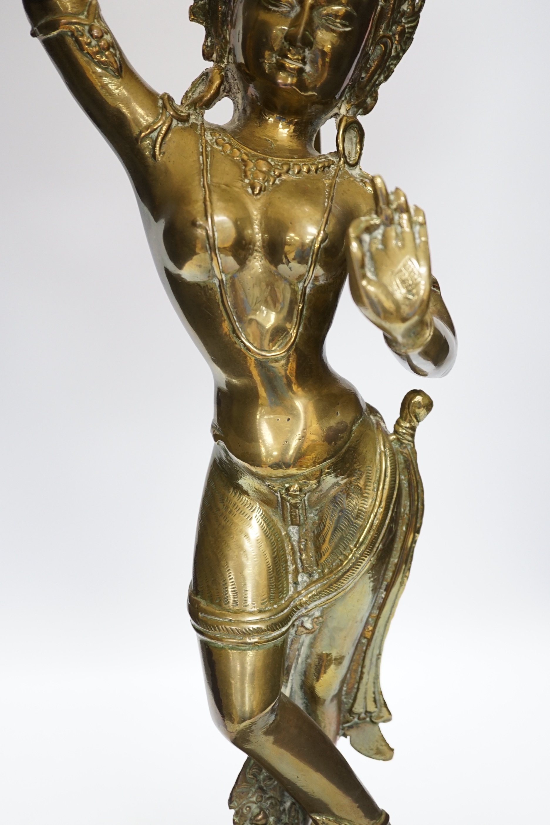 A vintage Indian polished brass figure of a dancer on lotus base, now mounted as a lamp, 80cm including shade